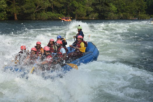 A group of people enjoy an exciting white water rafting adventure on a sunny day.